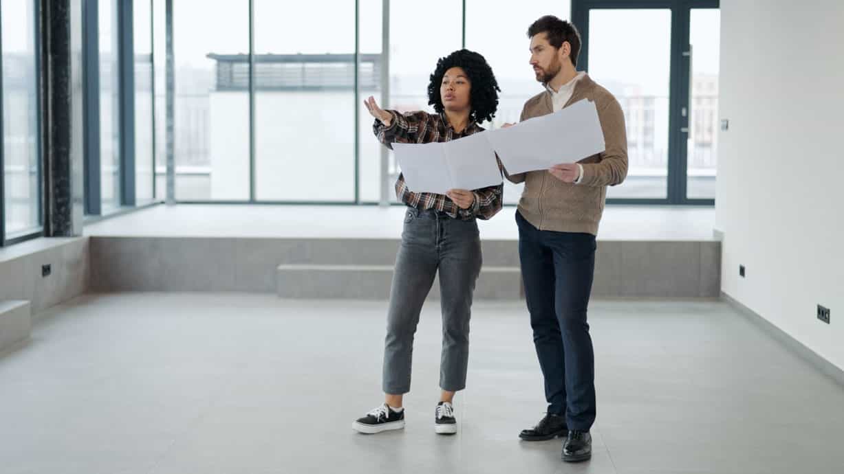 Two investment brokers touring a commercial real estate asset